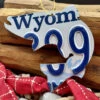 Cody Richardson Art - Wyoming Blue/White Trout License Plate Christmas Ornament -Simms || Orvis || Patagonia Sales BlueWYJumpingOrnament1 1024x1024 2x 4d760be8 093b 4553 8630 50bcb99f2a55